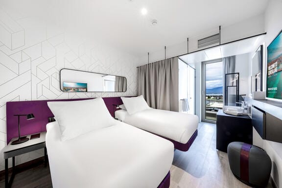 A bright, airy room with a SmaryBed and flatscreen TV