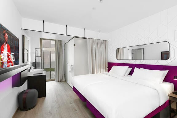 A bright, airy room with a SmaryBed and flatscreen TV