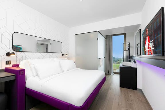 A bright, airy room with a SmaryBed and flatscreen TV