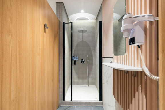 YOTEL Istanbul Airside Recharge Cabins shows shower cubicle with rainshower