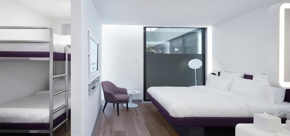 YOTEL Istanbul Airside Family room with queen SmartBed and bunk beds separated by wall