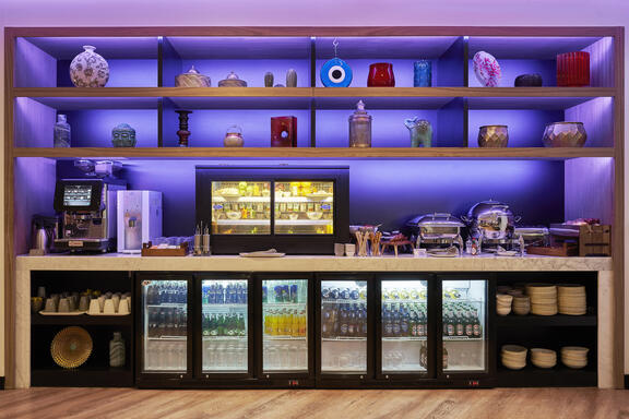 YOTEL Istanbul Airside Hotel's Grab and Go station with fridges full of drinks and snacks