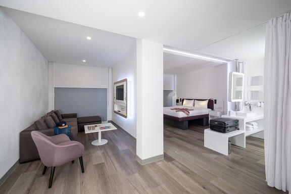 YOTEL Istanbul Landside First Class junior suite with separate living area and sofa