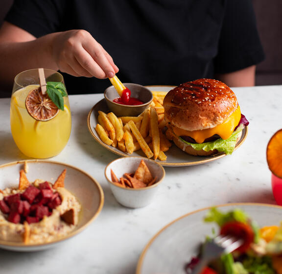 Dinner time in YOTEL Istanbul Landside features a wide choice of options including burgers, hummus and salads
