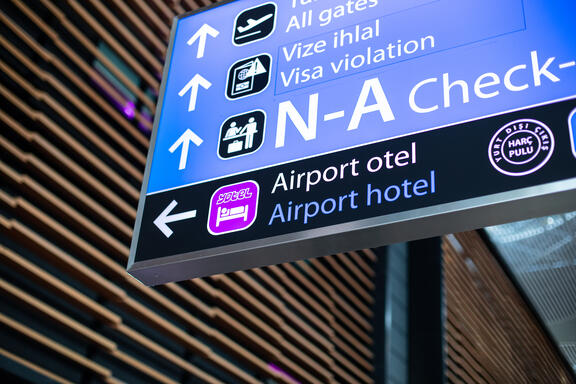 Airport signage showing directions to YOTEL Istanbul Landside