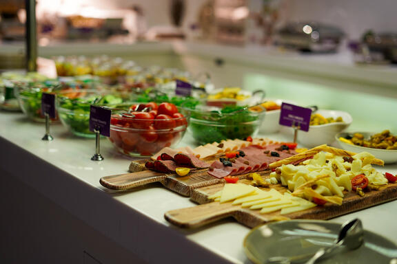 YOTEL Istanbul Landside continental style buffet breakfast with cheese, ham and salad on display