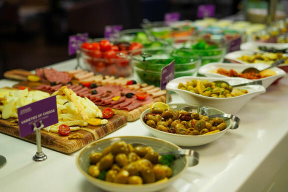 YOTEL Istanbul Landside continental style buffet breakfast with cheese, ham and olives on display