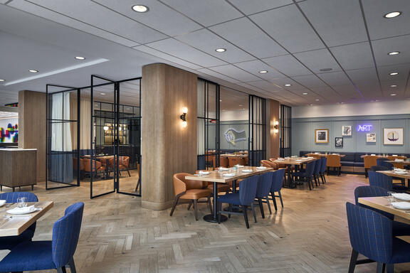 YOTEL Washington DC Art and Soul restaurant shows multiple tables set up in large open space