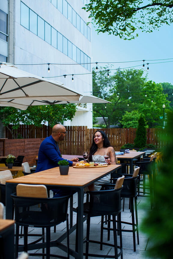 YOTEL Washington DC's Art and Soul bar and restaurant with couple enjoying drinks