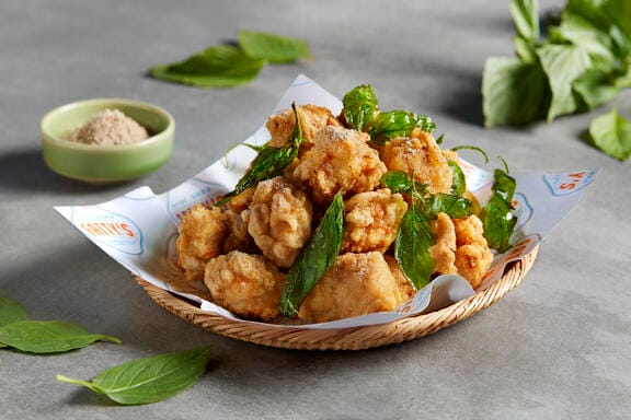 Chicken nuggets covered in leaves 
