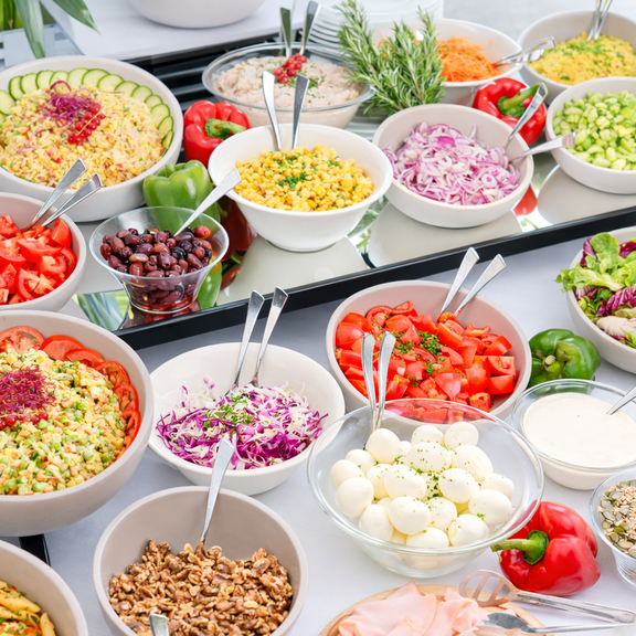 A large selection of food across the table 