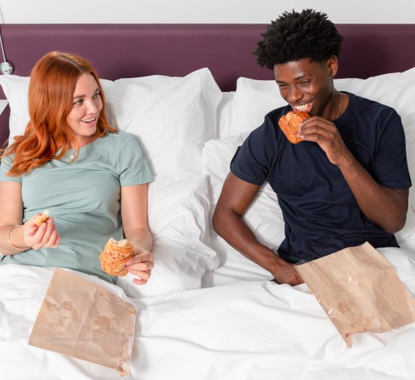 Guests eating in the bed
