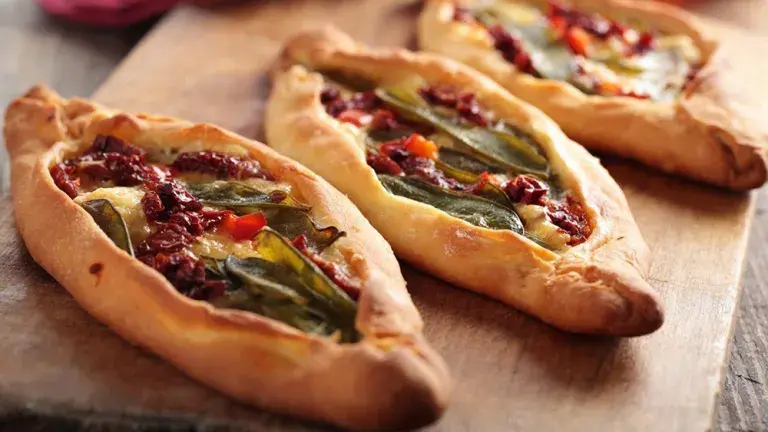 Istanbul pide dish on chopping board