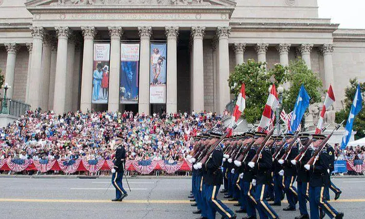 Military marching in a parade with flags in Washington DC
