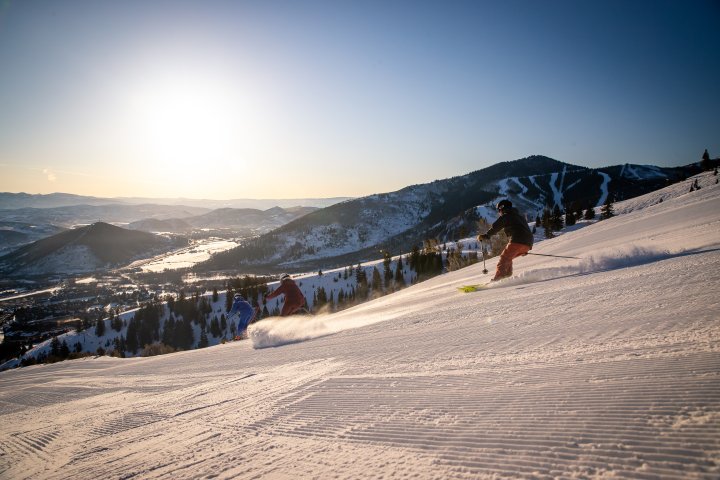 person skiing down the slopes - YOTEL Park City, Utah