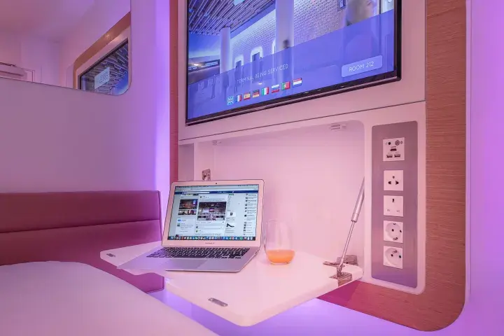 YOTELAIR Paris CDG pullout desk with laptop