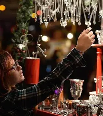 lady by a Christmas stand in San Francisco