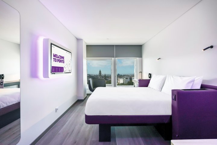YOTEL Cabin design including a bed, bathroom and a window with a city view