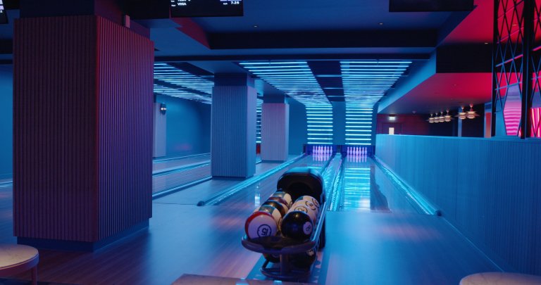 Neon-lit bowling alley