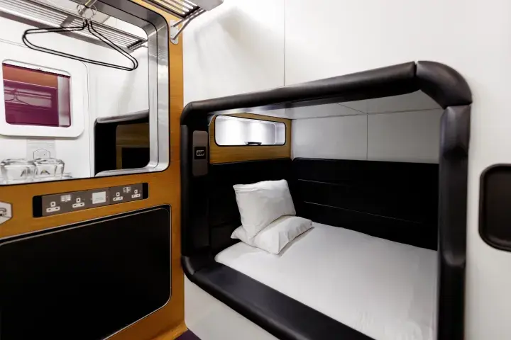 Compact room with bed, storage, plugs, tea and coffee facilities and a flatscreen TV