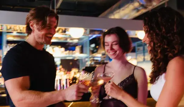 Group of friends toasting with drinks