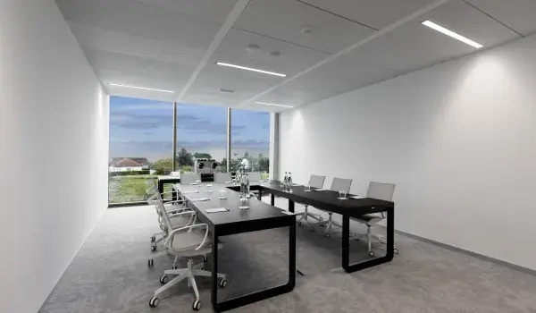 Meeting room set up with table in horse-shoe shape
