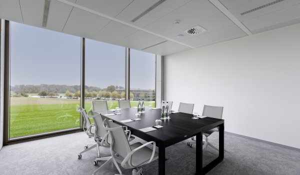Meeting room with board room table in middle