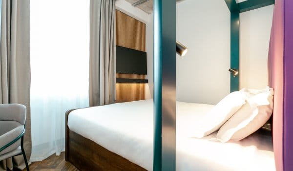 View of King Room with bed in middle