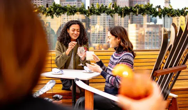Women on a terrace drinking cocktails