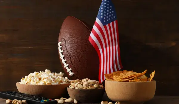An American flag, an American football, and plenty of snacks