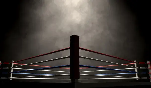 An empty wresting ring in moody lighting
