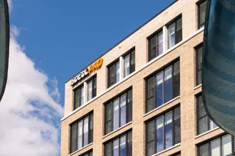 Top of hotel building showing YOTELPAD logo