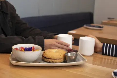 Breakfast bagel, tea and coffee