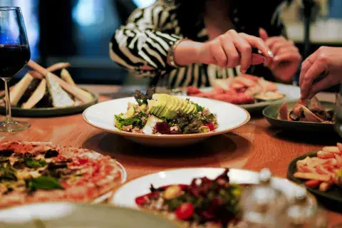 Hearty dishes laid out on a table with a red tablecloth