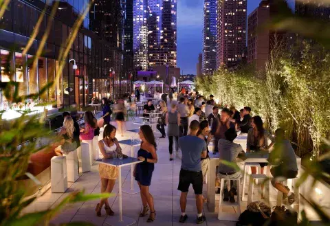 A large event on a rooftop bar in New York City
