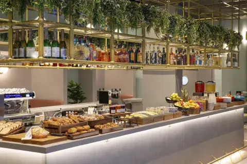 Food and drink spread at a buffet counter