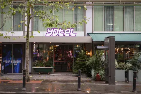 The facade of YOTEL Manchester on a rainy day