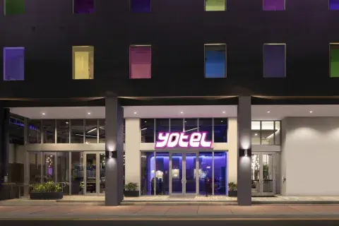 The front entrance of YOTEL Miami hotel at night