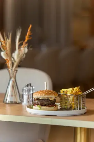 A hearty burger with a side of crispy chips
